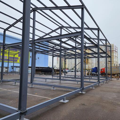 Производство и монтаж двухскатного склада из металлоконструкций для мебельного центра 